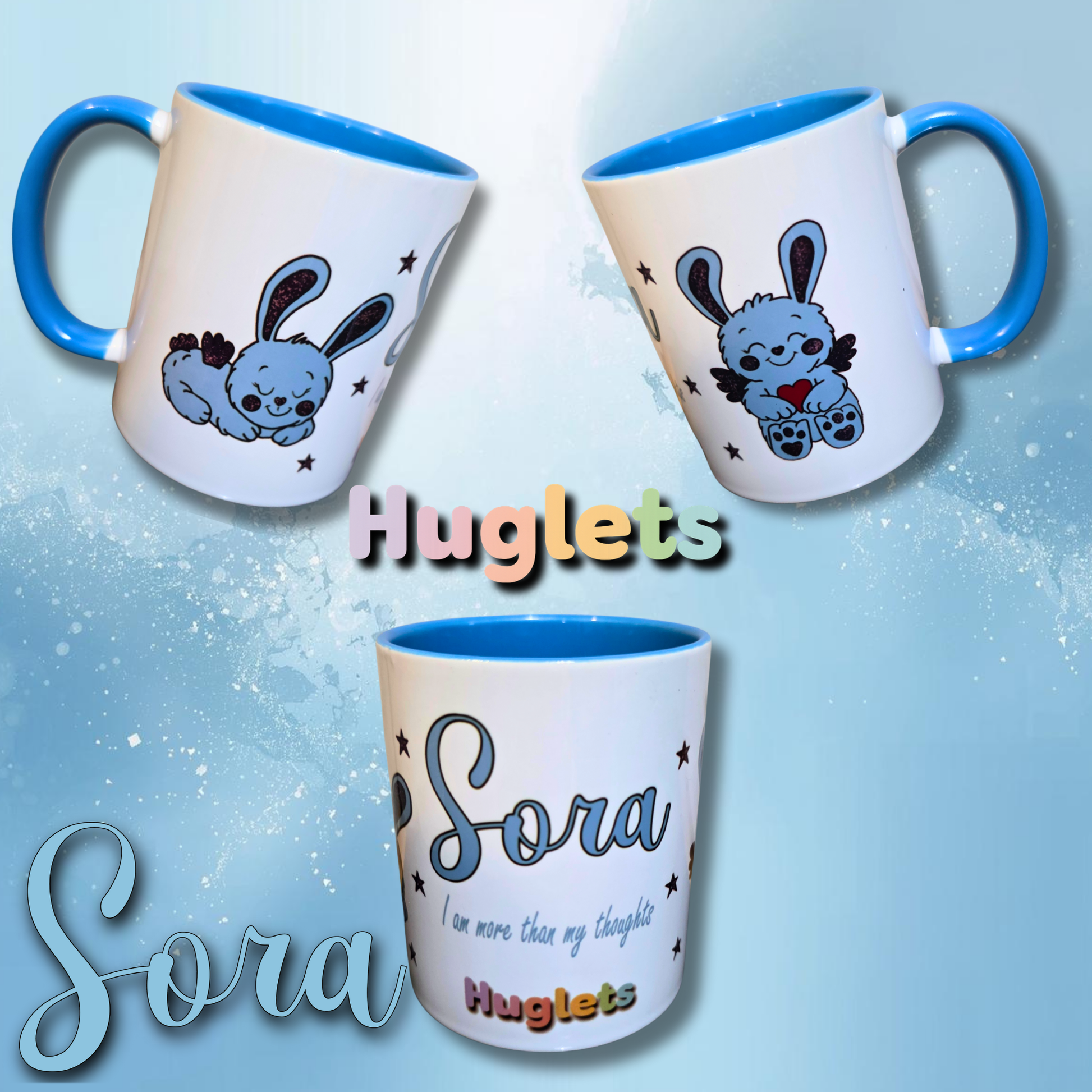 Two mugs with cartoon character design and 'Huglets' branding on a light blue background.
