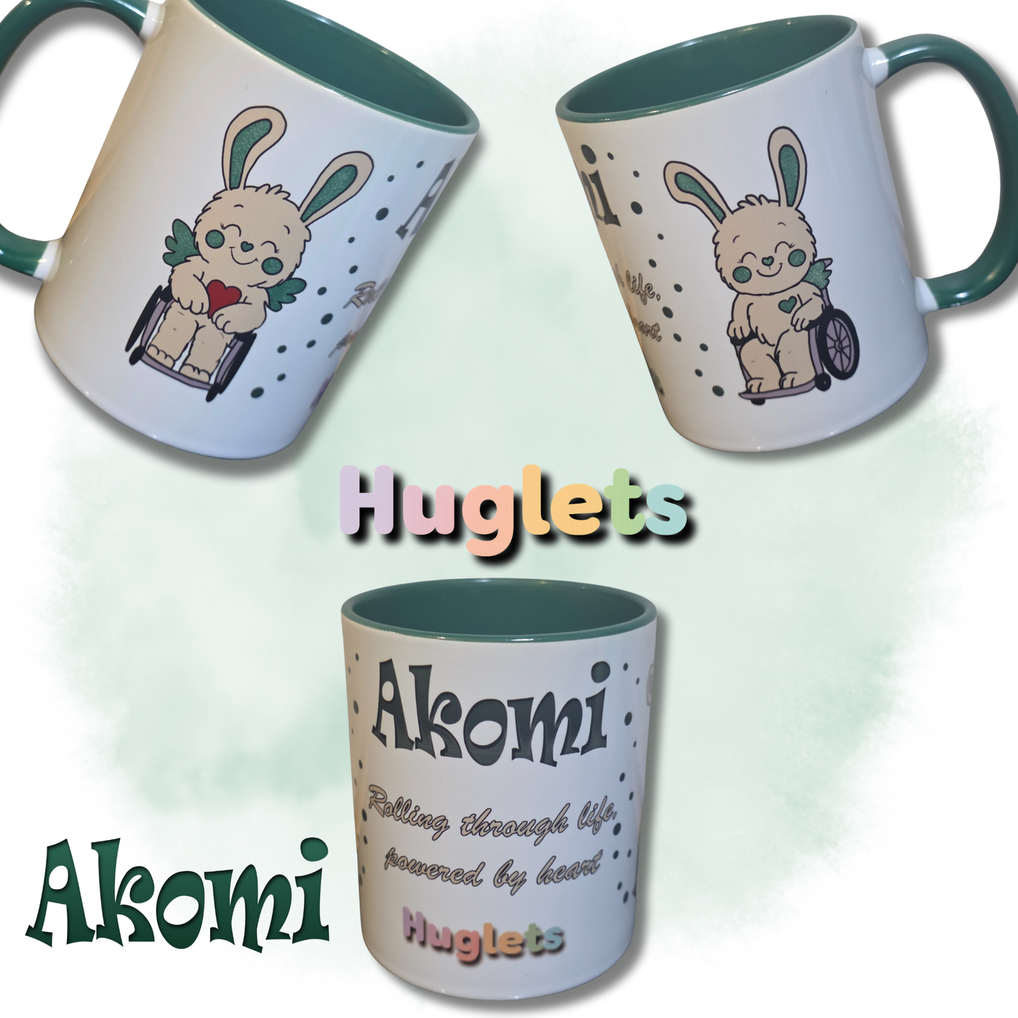 Mugs with Akomi character in wheelchair and text on a white background, and green inner featuring the brand 'Huglets'.
